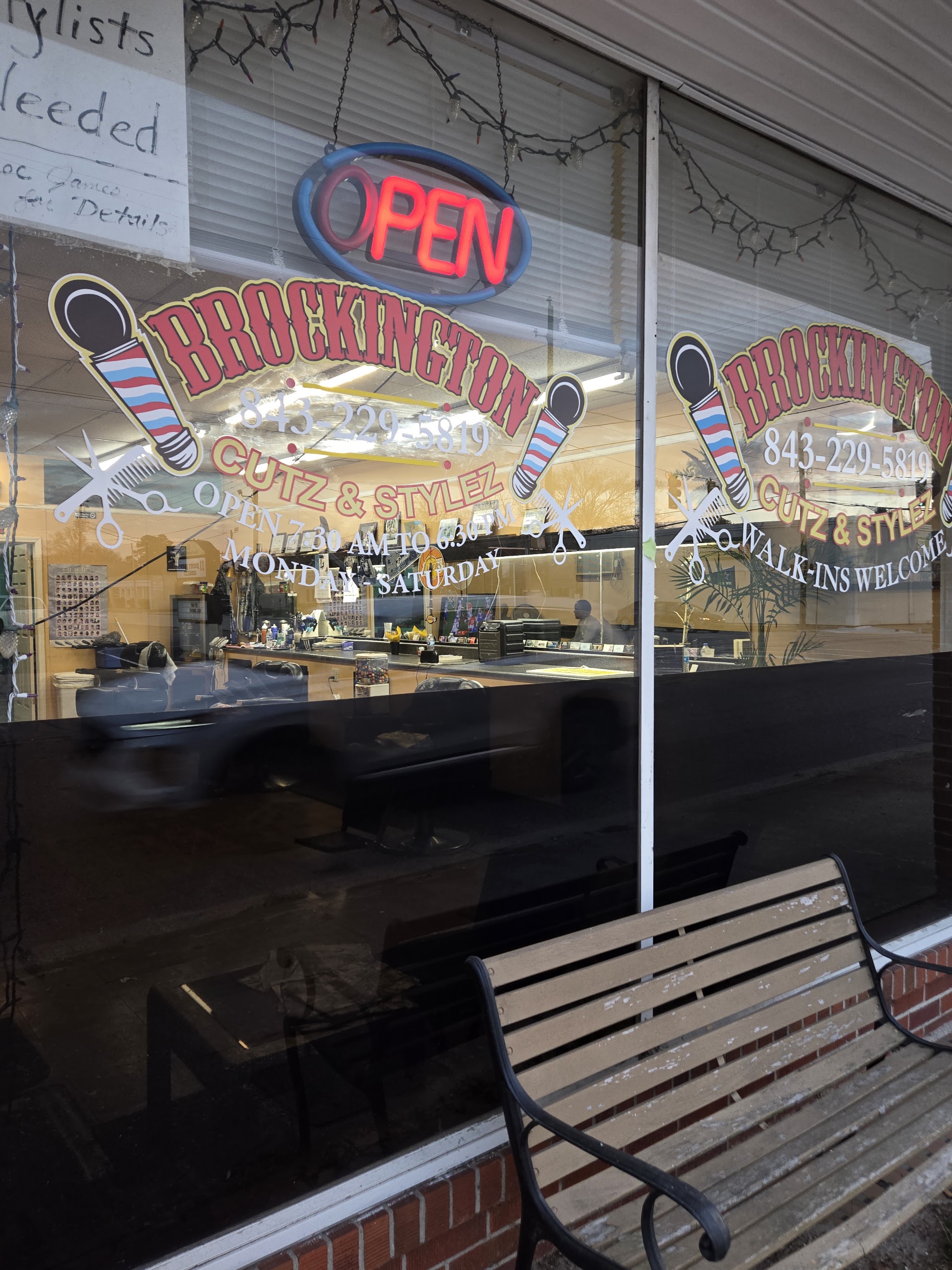 Shop window with the Brockington Cutz & Stylez lettering, an open sign and walk-ins welcome